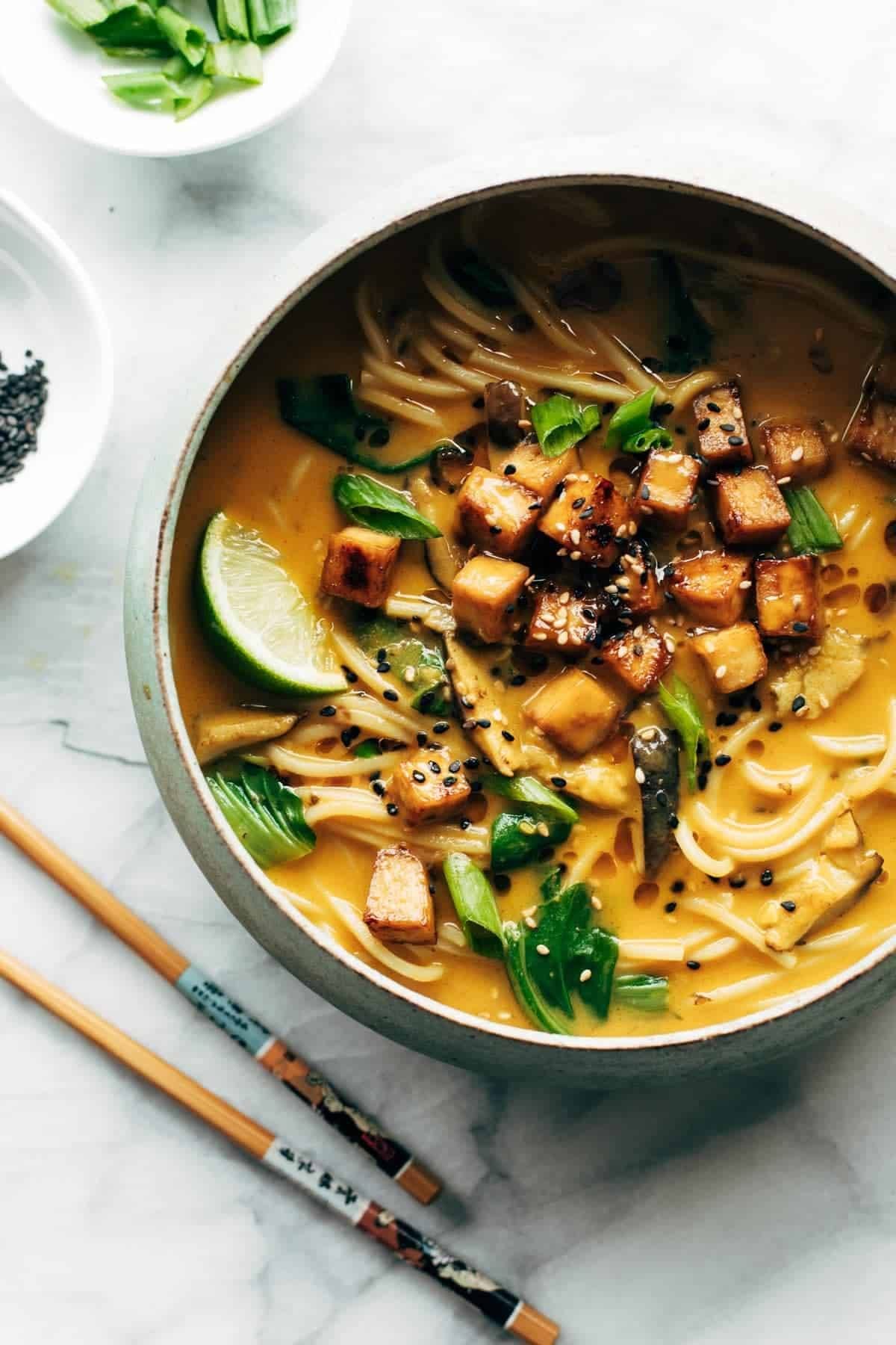 Coconut curry ramen in a bowl with tofu.