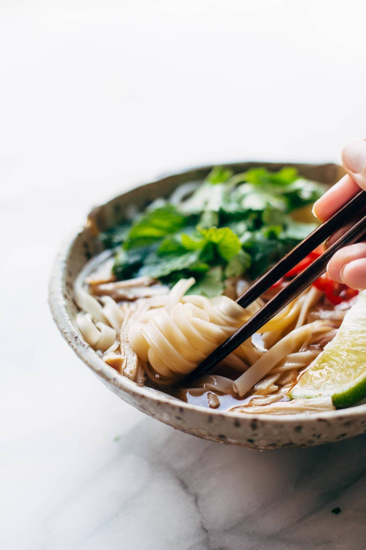 Turkey Pho recipe - LIGHT and so flavorful. All familiar ingredients that can be bought at a mainstream grocery store. Perfect for leftover turkey! | pinchofyum.com