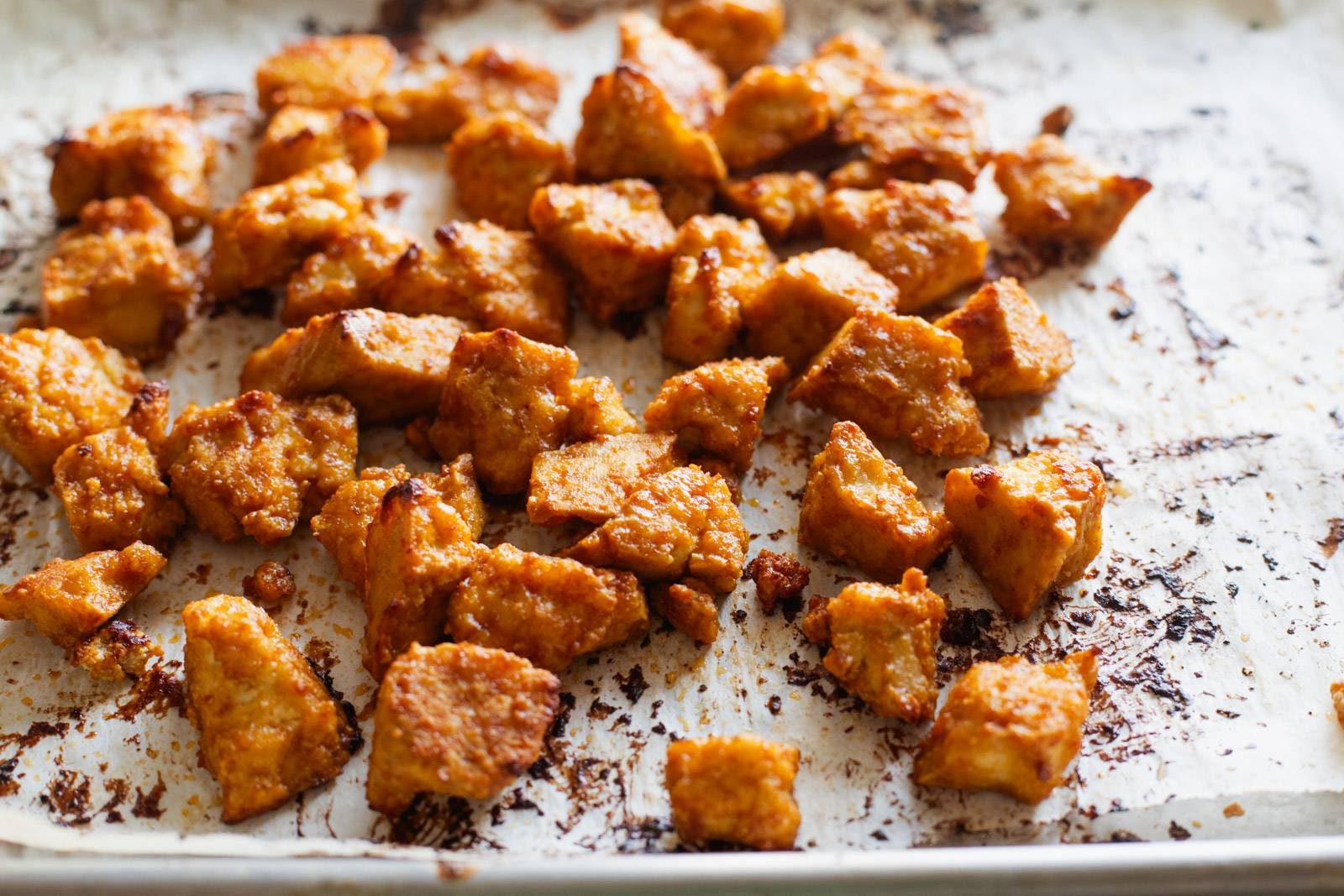 Crispy baked tofu on a sheet pan.